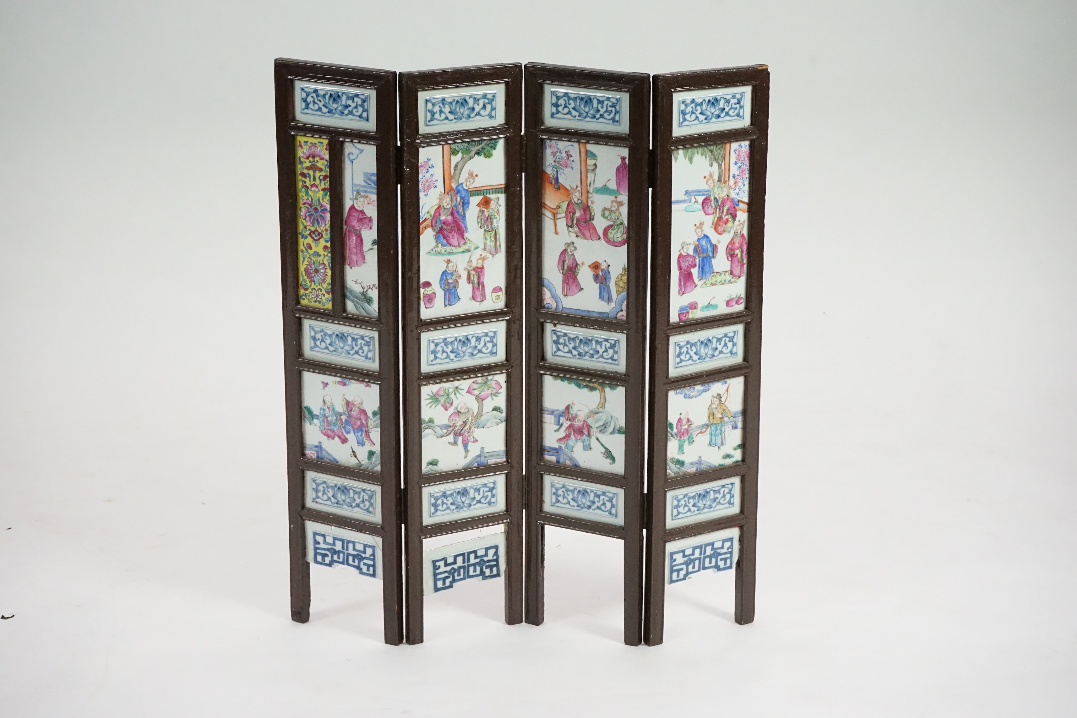 A Chinese wood framed and porcelain mounted low screen, late 19th century